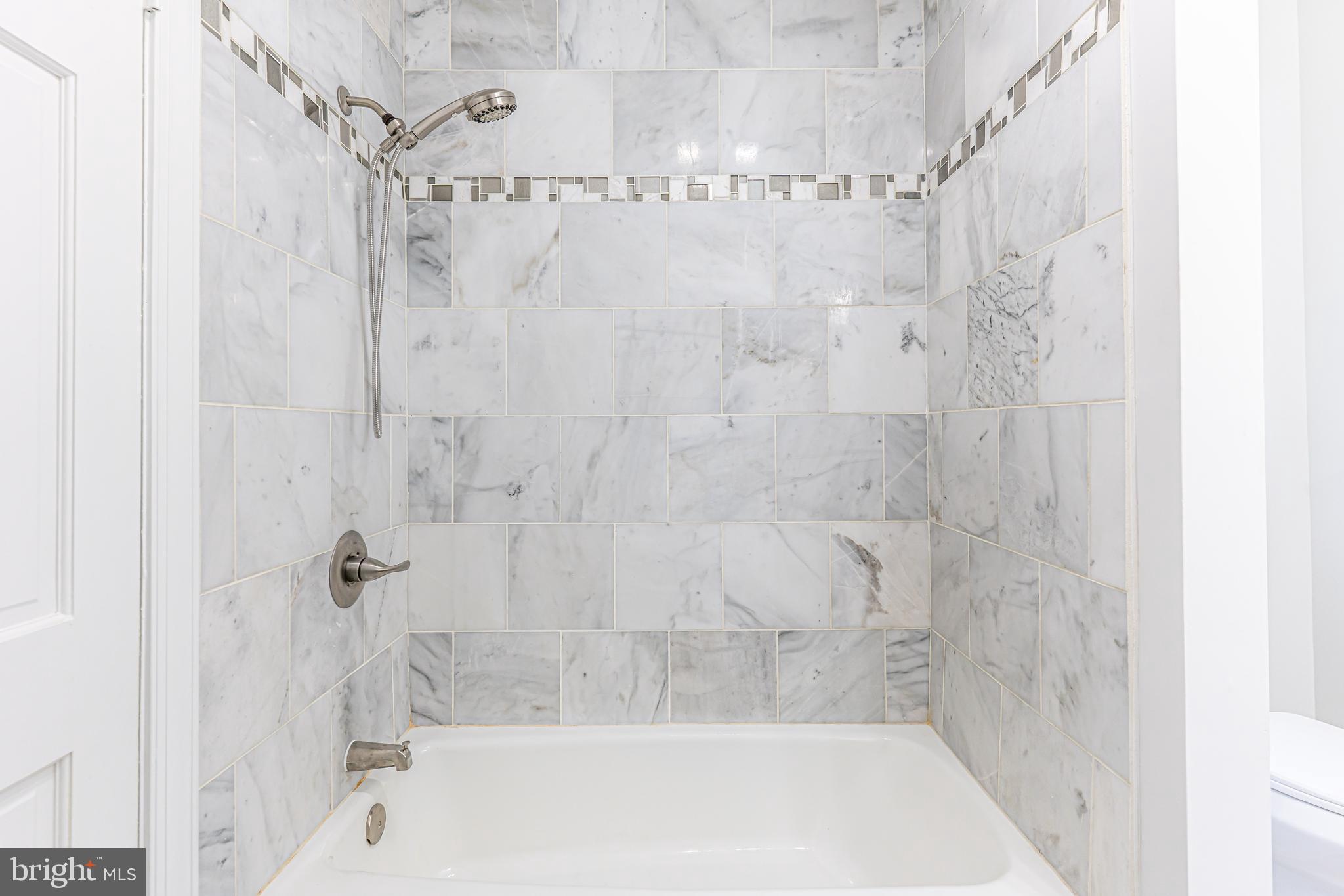 142 Woodland Road Fredericksburg, VA 22401 - Photo 32 of 49 a bathroom with a shower and a bath tub