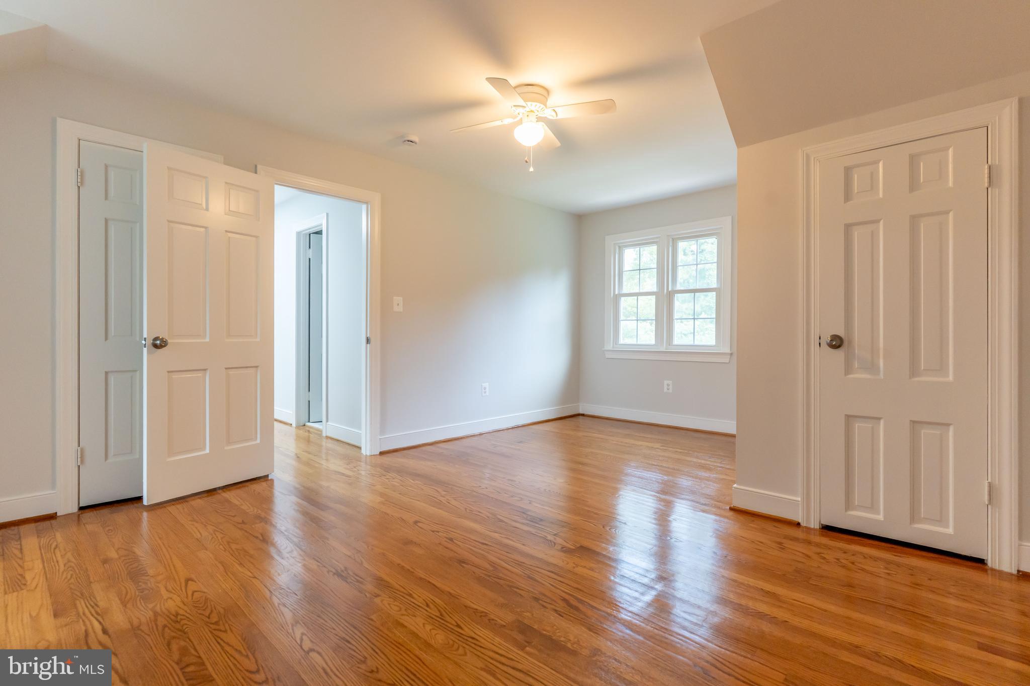 142 Woodland Road Fredericksburg, VA 22401 - Photo 34 of 49 an empty room with wooden floor and windows