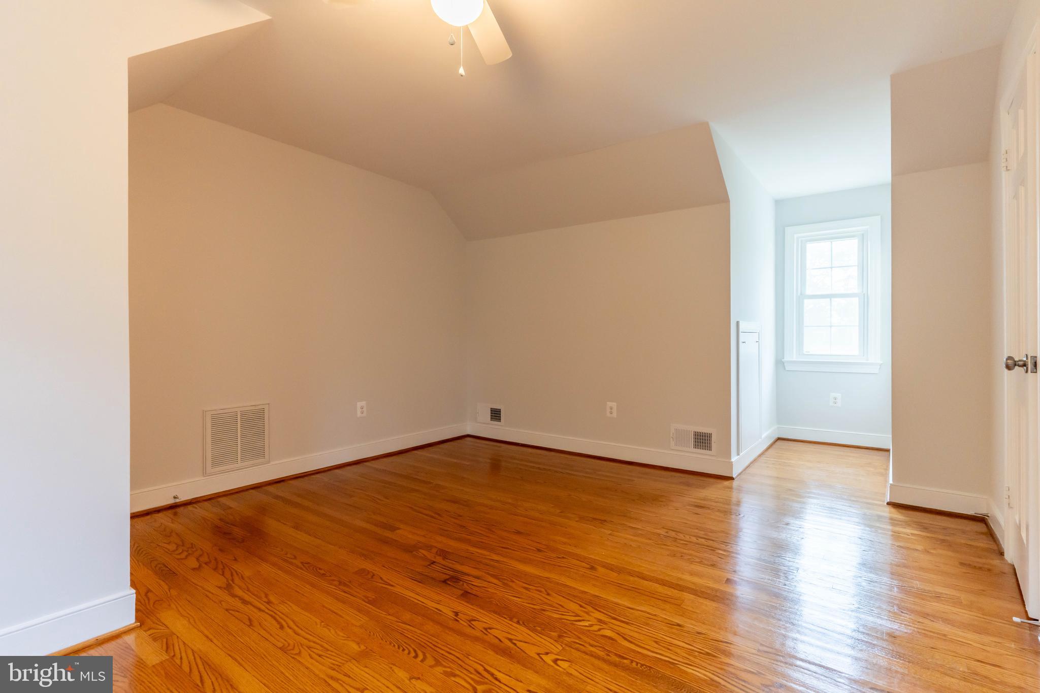 142 Woodland Road Fredericksburg, VA 22401 - Photo 35 of 49 an empty room with wooden floor