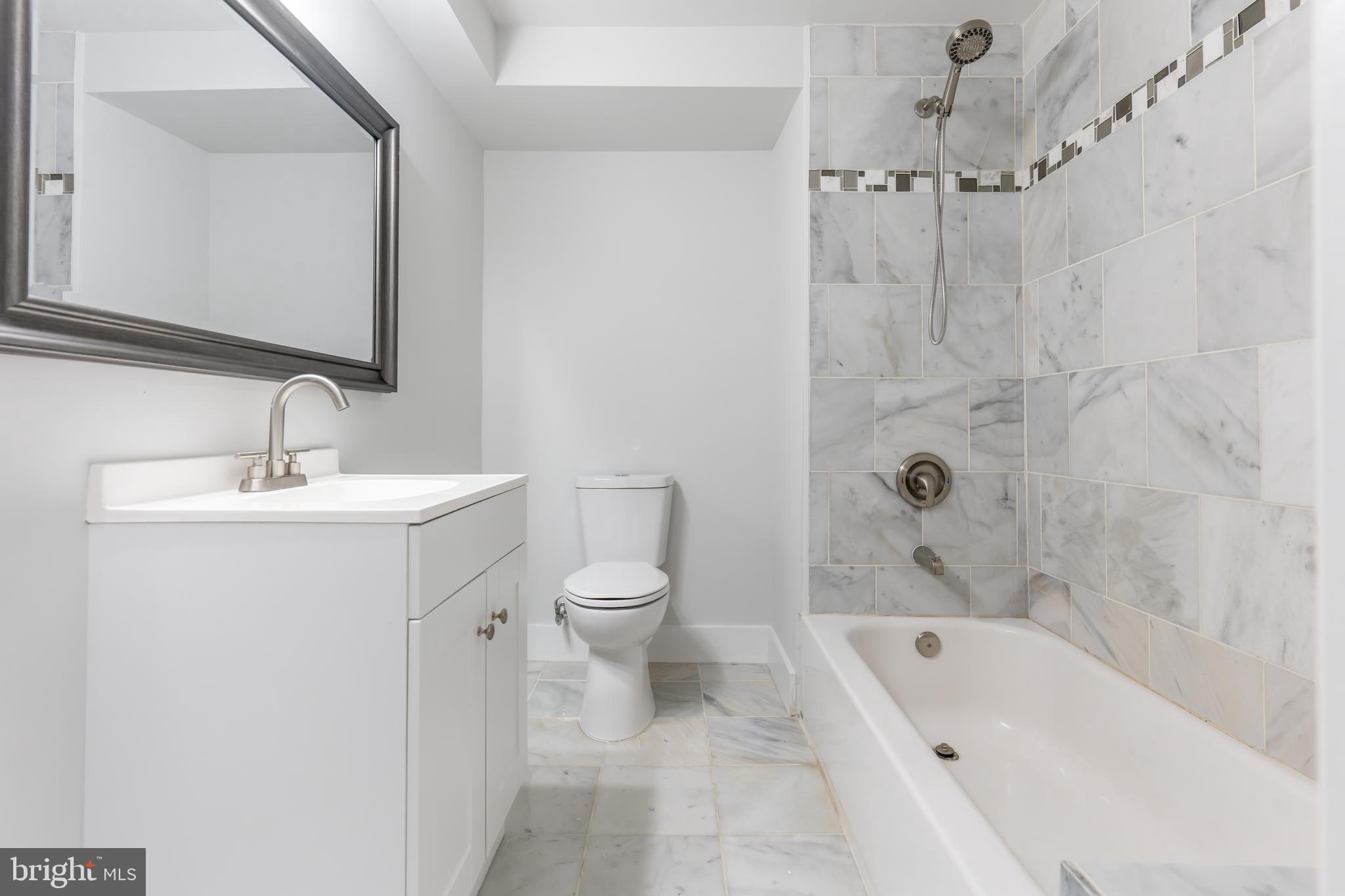 142 Woodland Road Fredericksburg, VA 22401 - Photo 39 of 49 a bathroom with a sink a toilet and shower