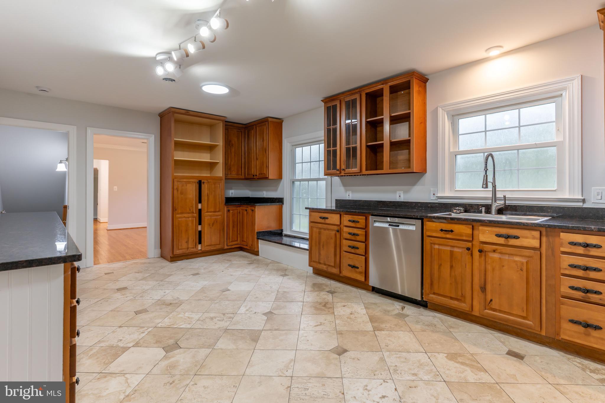 142 Woodland Road Fredericksburg, VA 22401 - Photo 10 of 49 a kitchen with stainless steel appliances granite countertop a stove and a sink