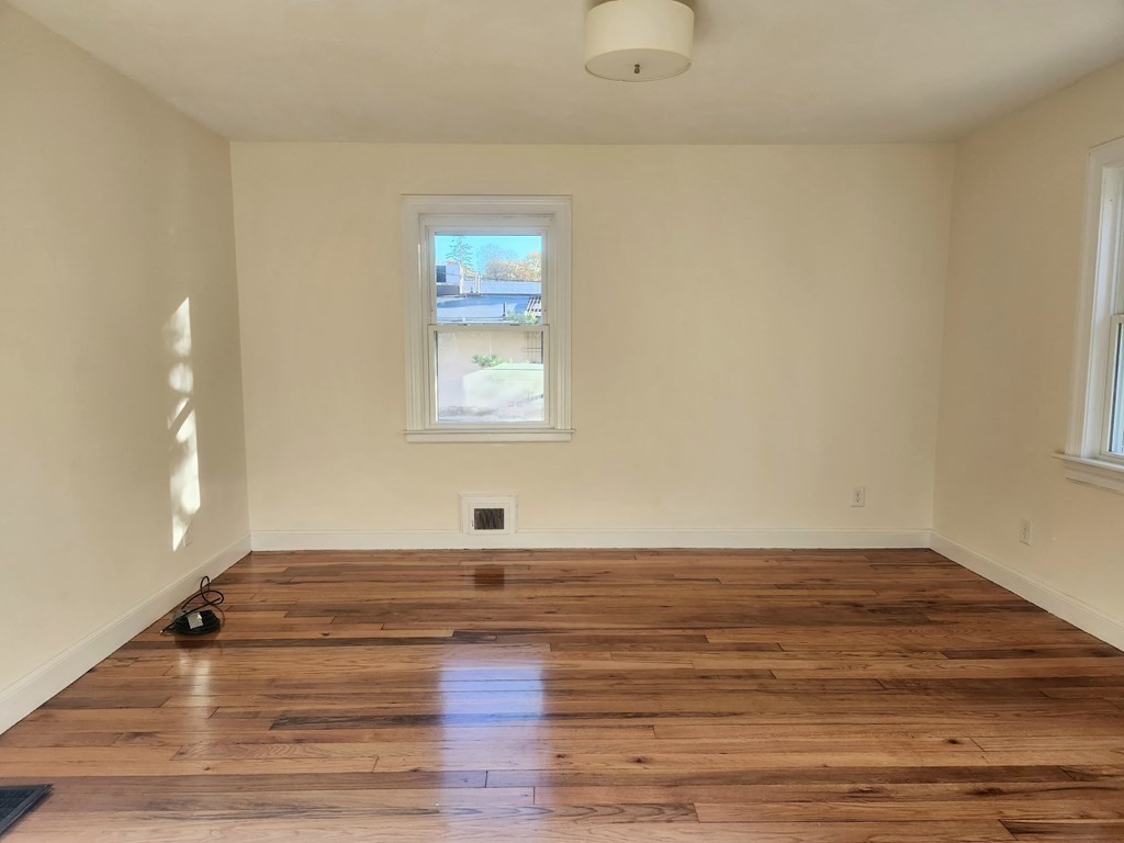 4 Pomona Road Worcester, MA 01602 - Photo 6 of 19 a view of a room with wooden floor and window