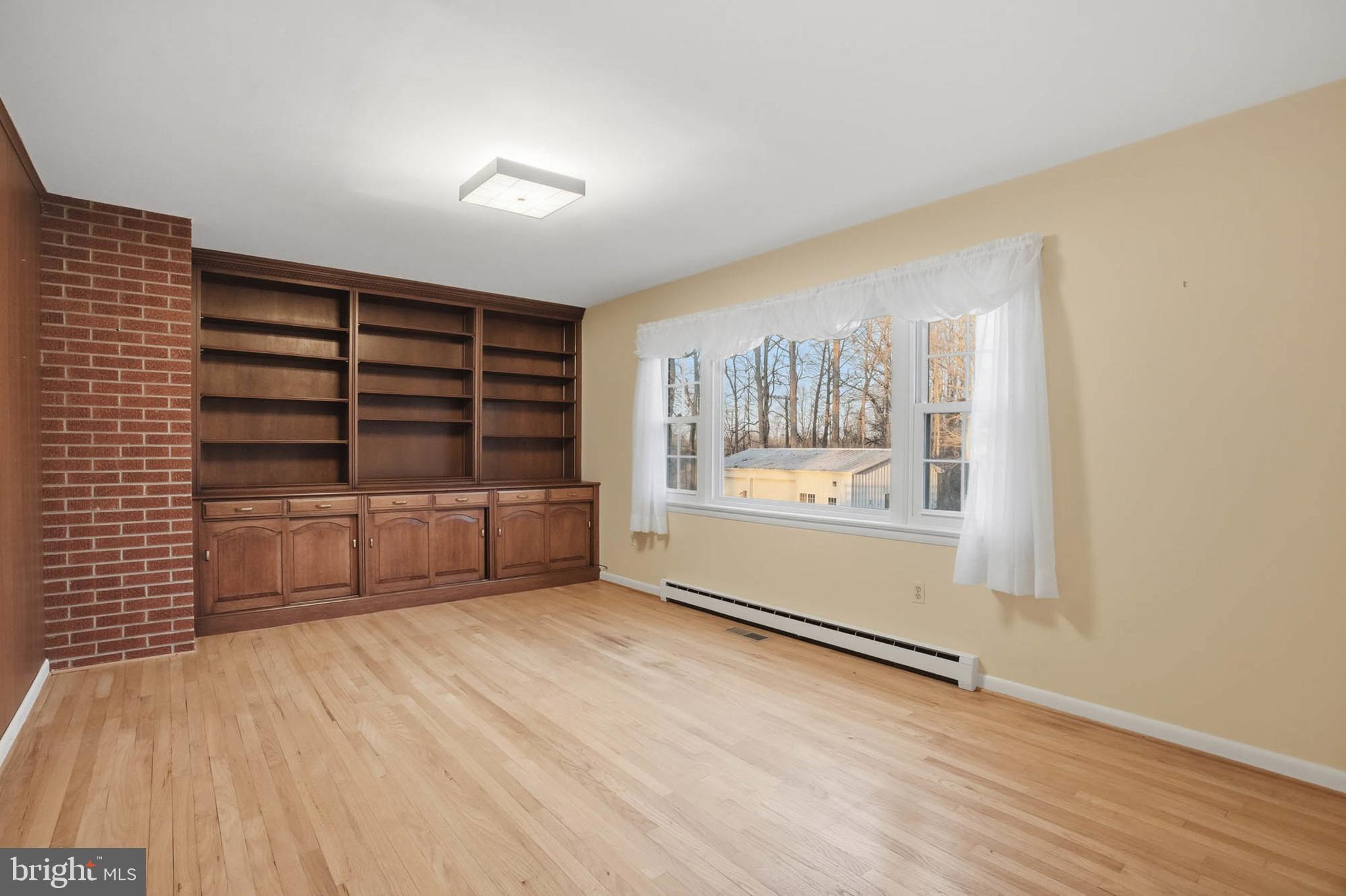 5407 Solomons Island Road Lothian, MD 20711 - Photo 17 of 42 a view of wooden floor and windows in a room