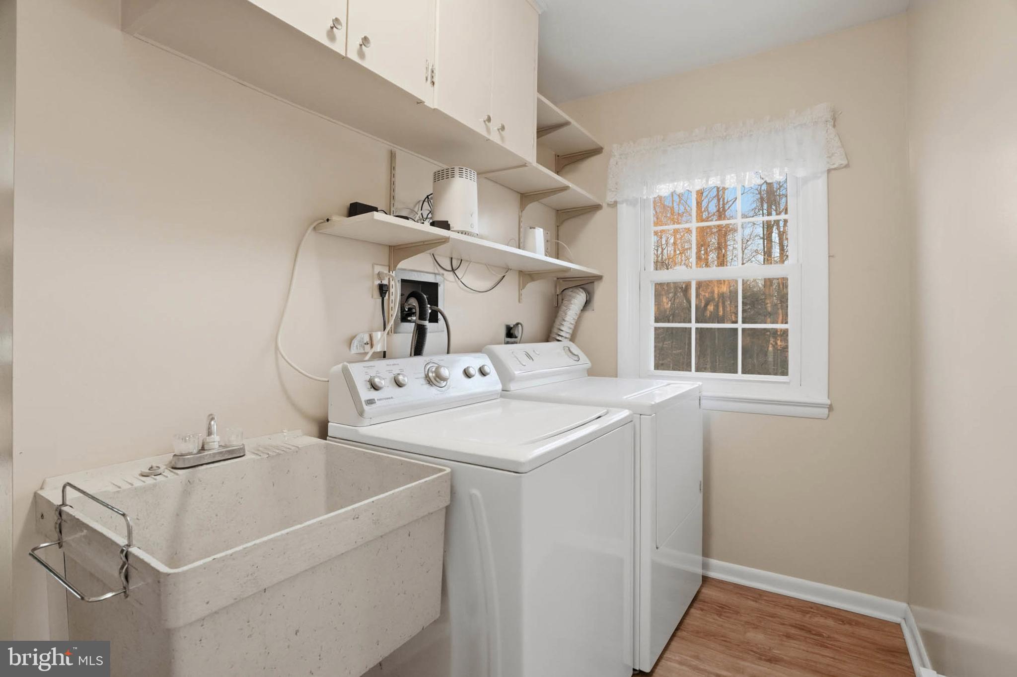 5407 Solomons Island Road Lothian, MD 20711 - Photo 19 of 42 a utility room with dryer and washer