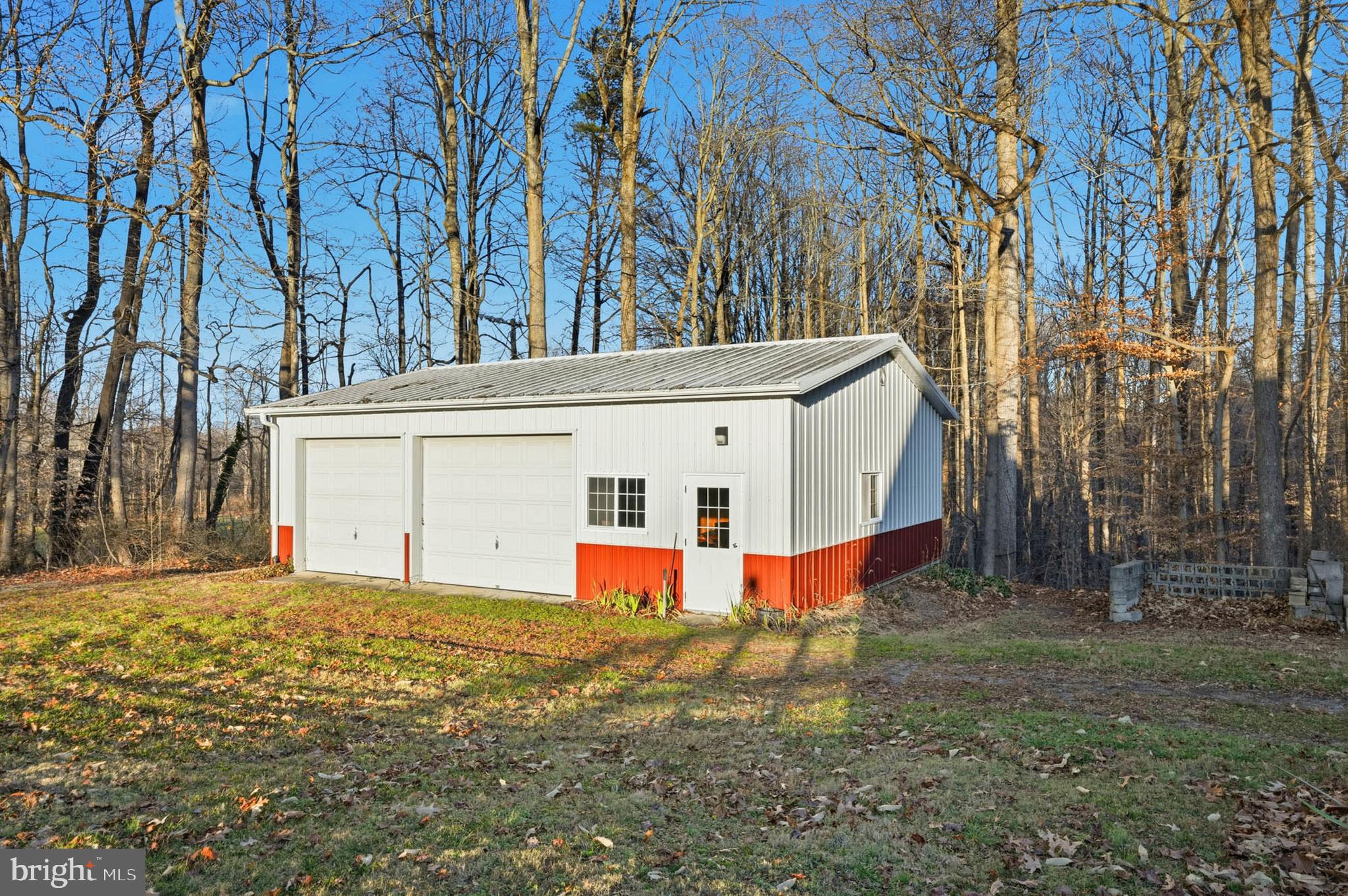 5407 Solomons Island Road Lothian, MD 20711 - Photo 35 of 42 a view of a house with backyard and trees