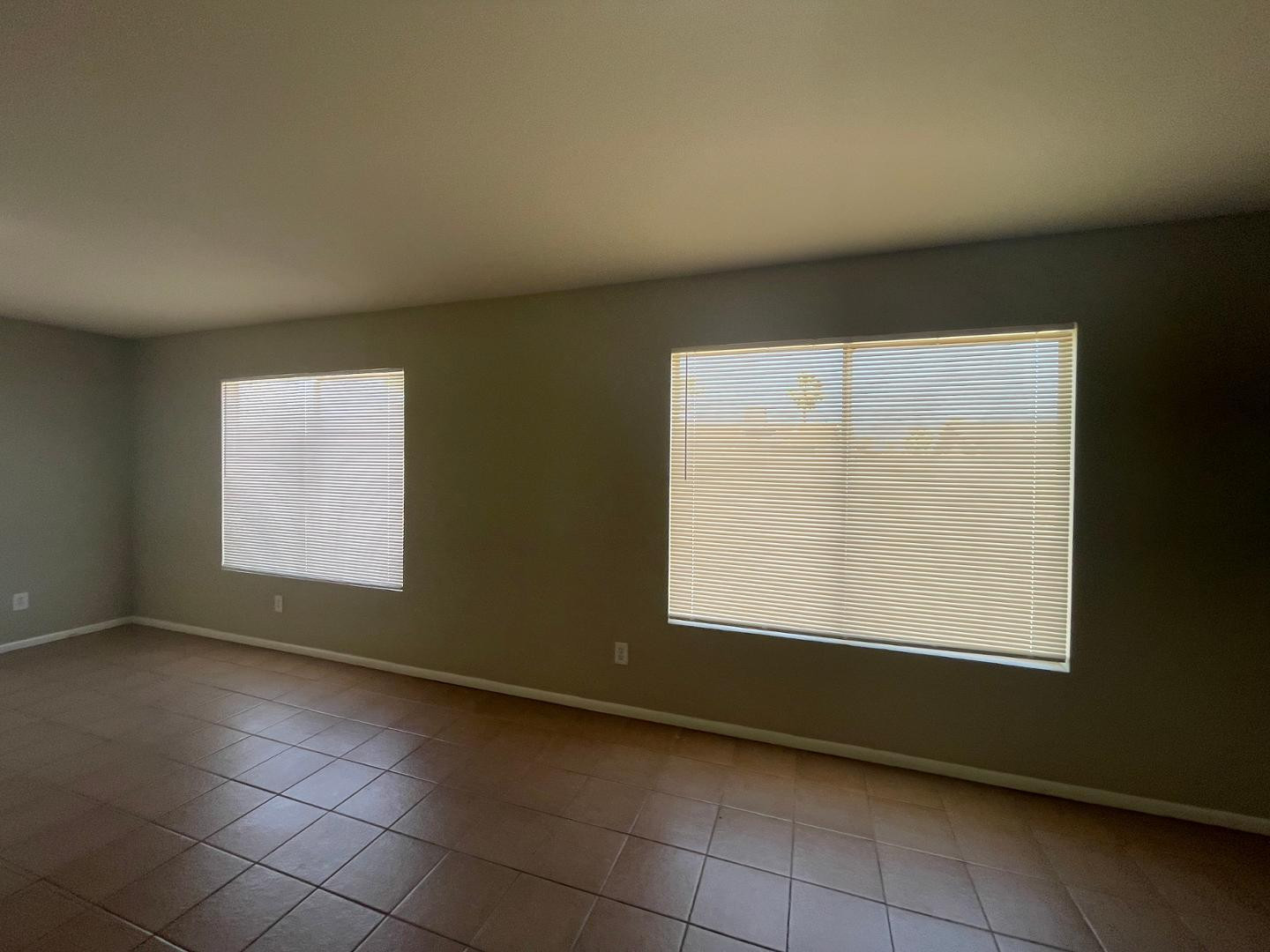 10902 West Montecito Avenue Phoenix, AZ 85037 - Photo 10 of 22 an empty room with a window