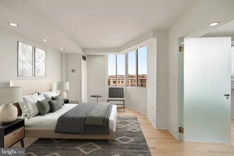 a bedroom with furniture and a window