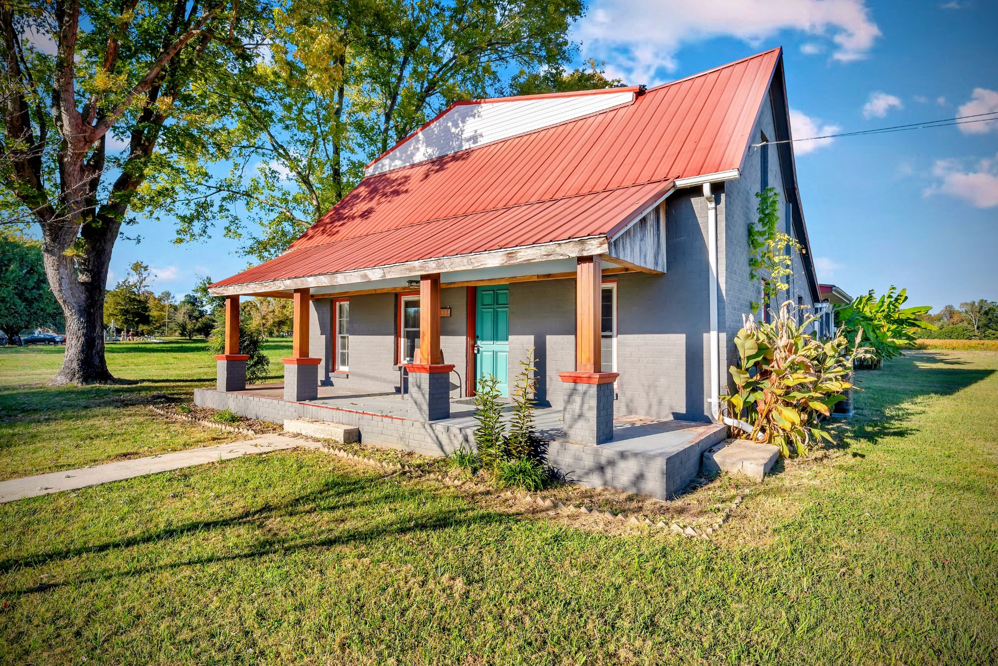 a front view of a house with garden