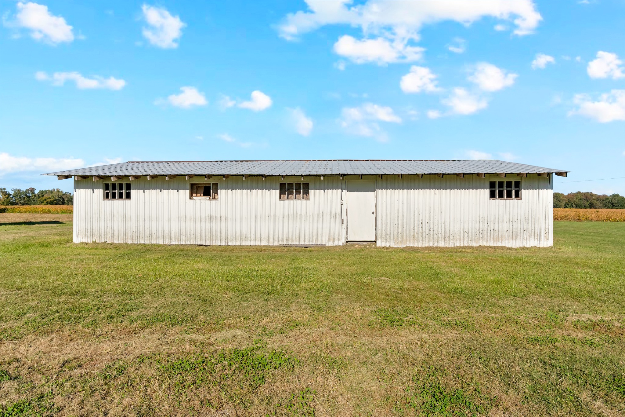 490 Shady Grove Road Manchester, TN 37355 - Photo 12 of 49 a view of a big room with wooden floor and windows