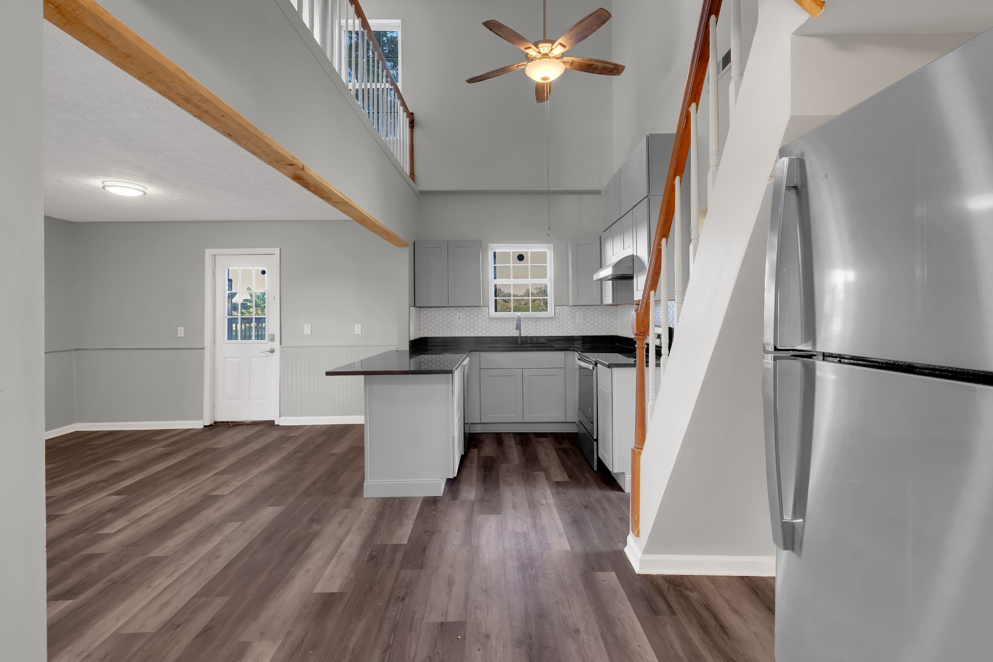 490 Shady Grove Road Manchester, TN 37355 - Photo 24 of 49 a kitchen with kitchen island wooden floor and refrigerator