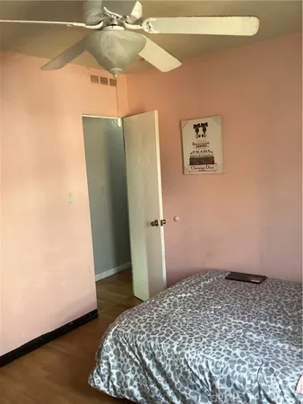 a bedroom with a bed and a walk in closet