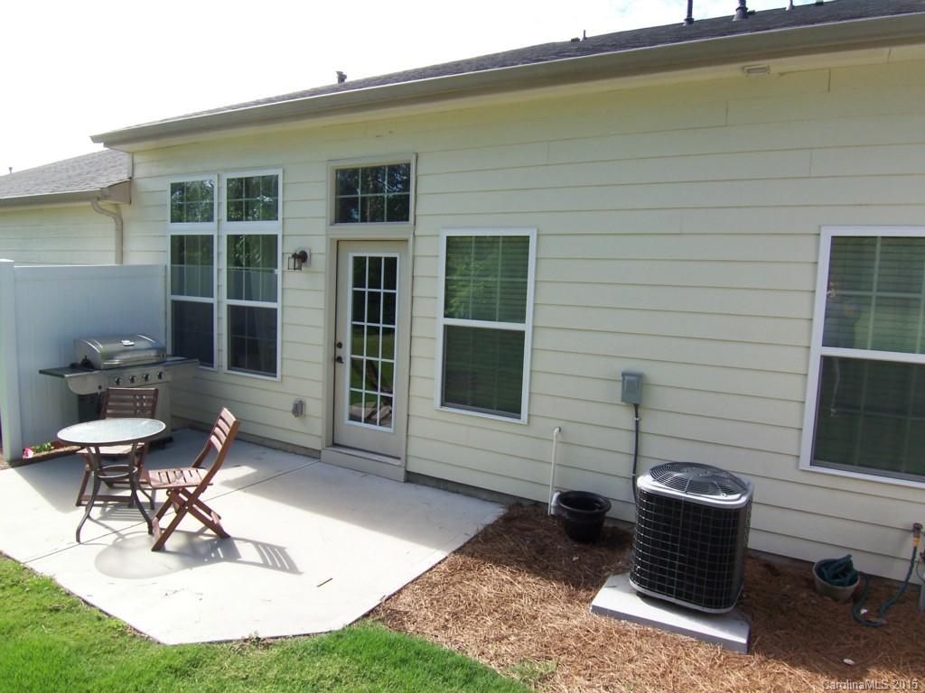 109 Inlet Point Drive, Unit 80 Tega Cay, SC 29708 - Photo 14 of 15 a building outdoor space with patio furniture