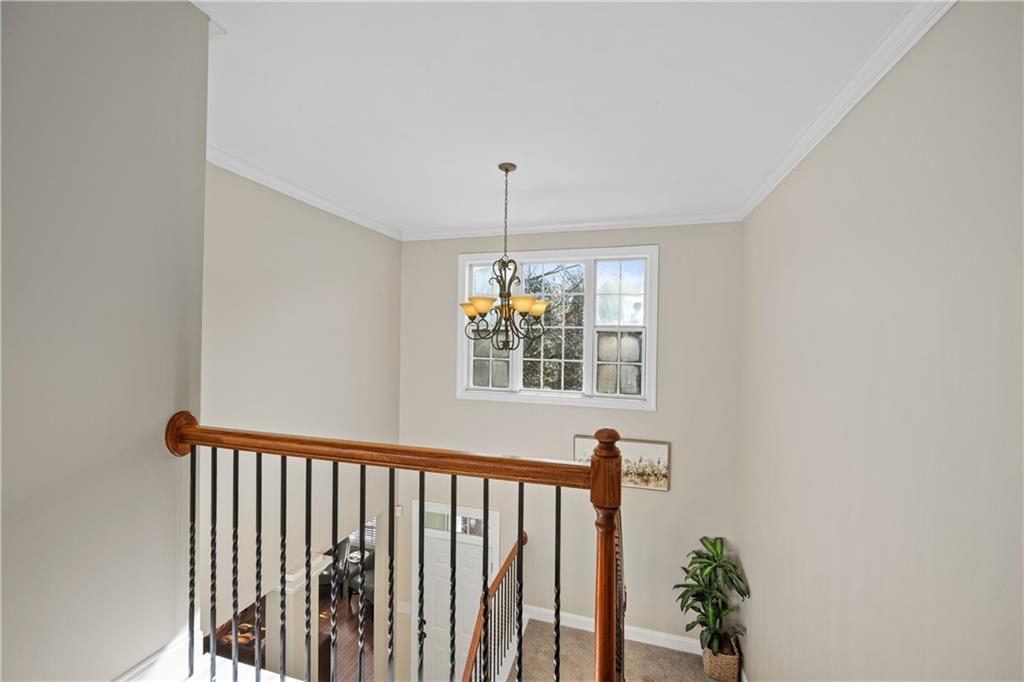 129 Boulder View Court Dallas, GA 30157 - Photo 19 of 43 a view of a hallway with windows and chandelier