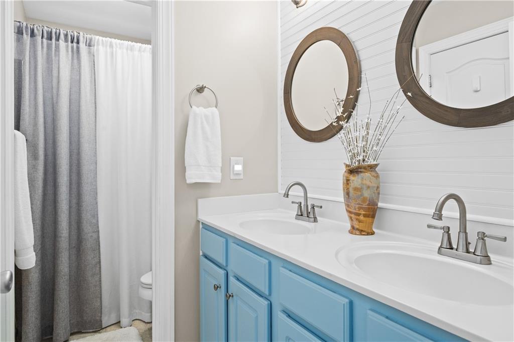 129 Boulder View Court Dallas, GA 30157 - Photo 27 of 43 a bathroom with a sink and a mirror