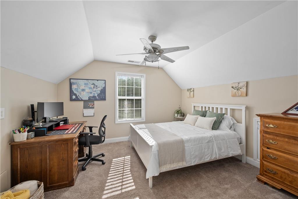 129 Boulder View Court Dallas, GA 30157 - Photo 28 of 43 a bedroom with a bed furniture and window