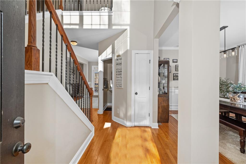 129 Boulder View Court Dallas, GA 30157 - Photo 3 of 43 a view of a hallway with wooden floor and staircase