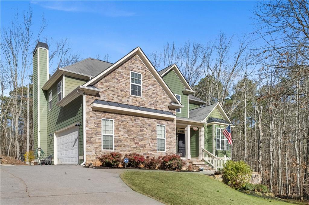 129 Boulder View Court Dallas, GA 30157 - Photo 41 of 43 a front view of a house with garden