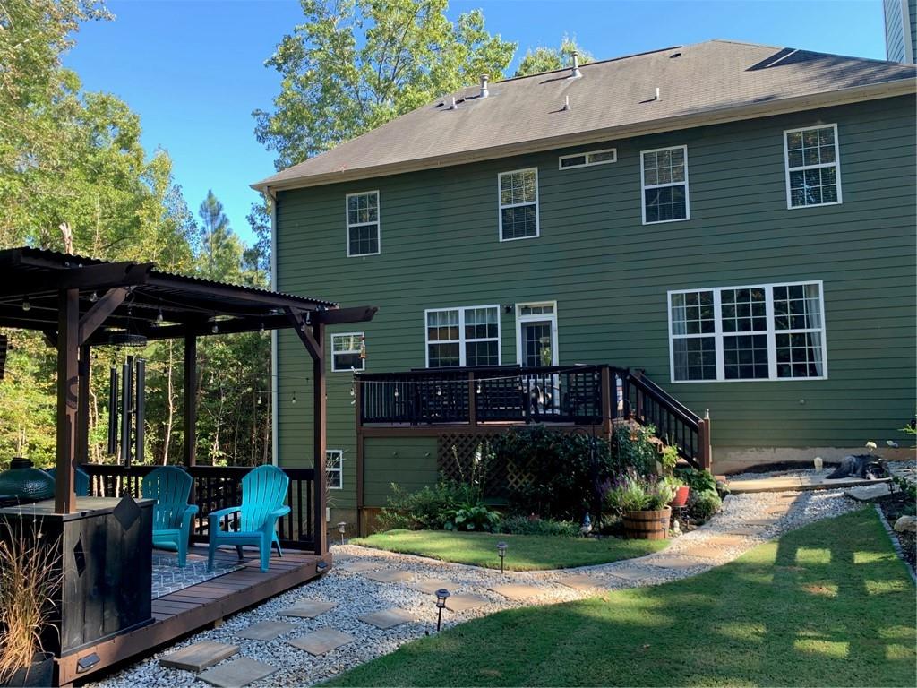 129 Boulder View Court Dallas, GA 30157 - Photo 43 of 43 a view of a house with backyard porch and sitting area
