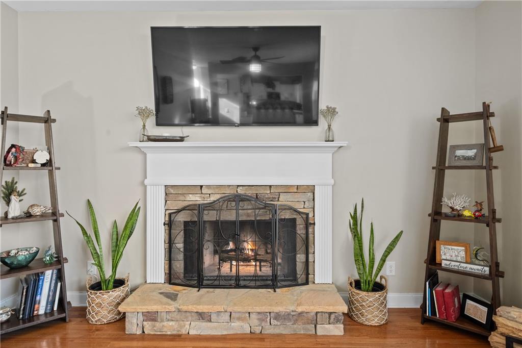 129 Boulder View Court Dallas, GA 30157 - Photo 8 of 43 a living room with furniture and a fireplace