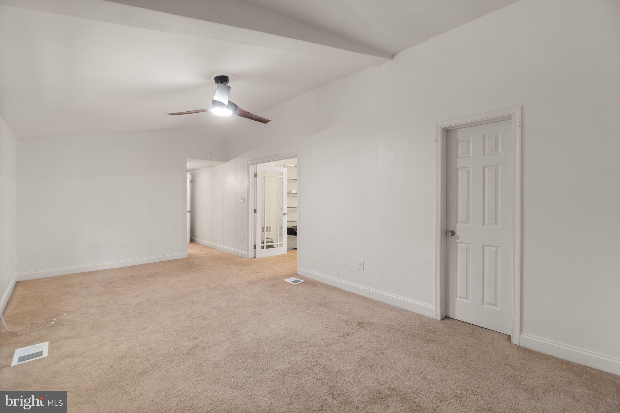 9528 Wandering Way Columbia, MD 21045 - Photo 15 of 29 a view of empty room with ceiling fan
