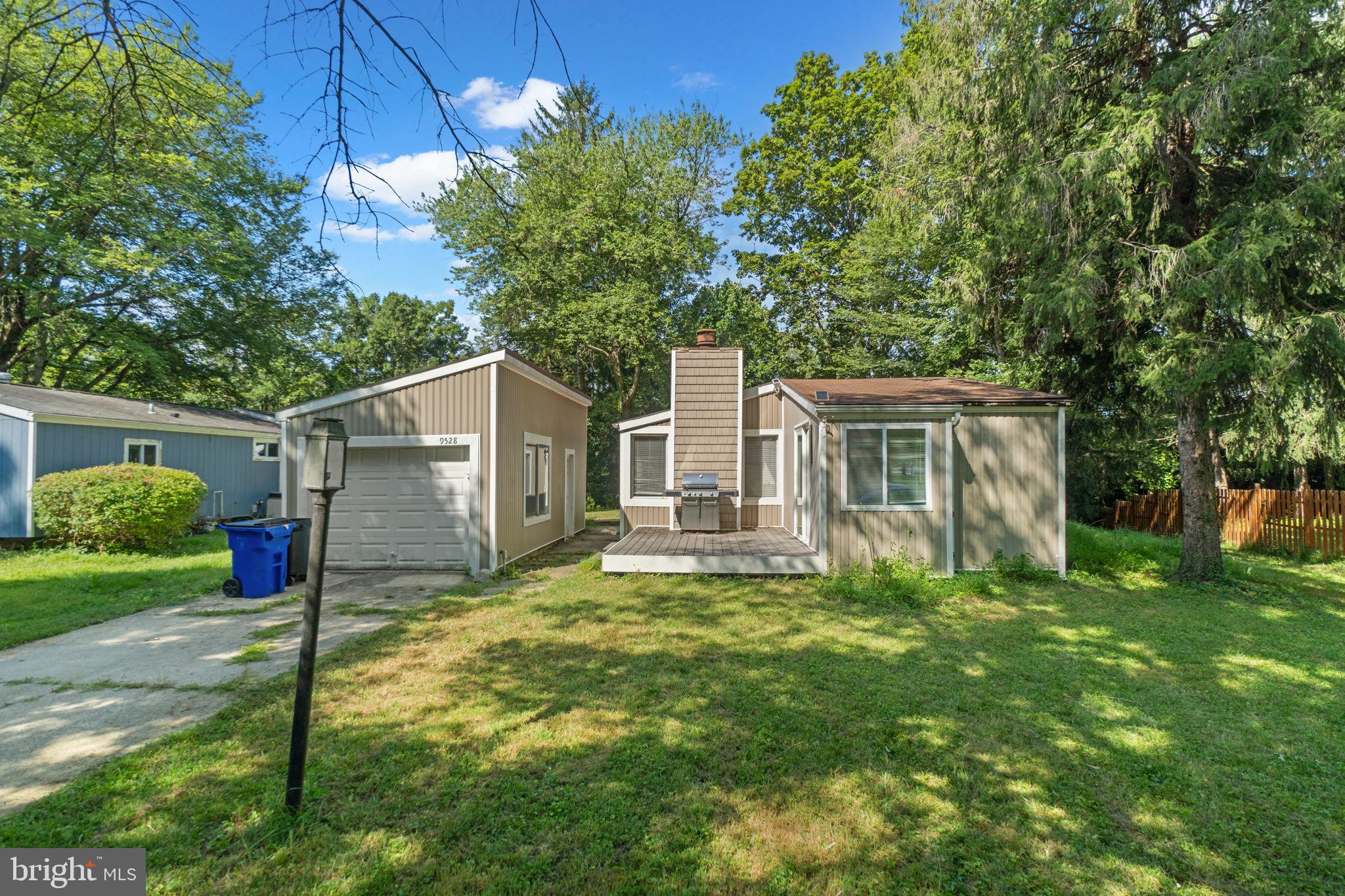 9528 Wandering Way Columbia, MD 21045 - Photo 2 of 29 a view of a house with backyard and a tree