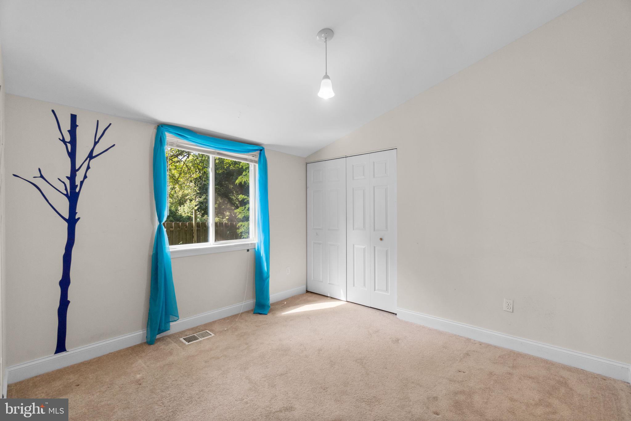 9528 Wandering Way Columbia, MD 21045 - Photo 21 of 29 a view of an empty room with a window