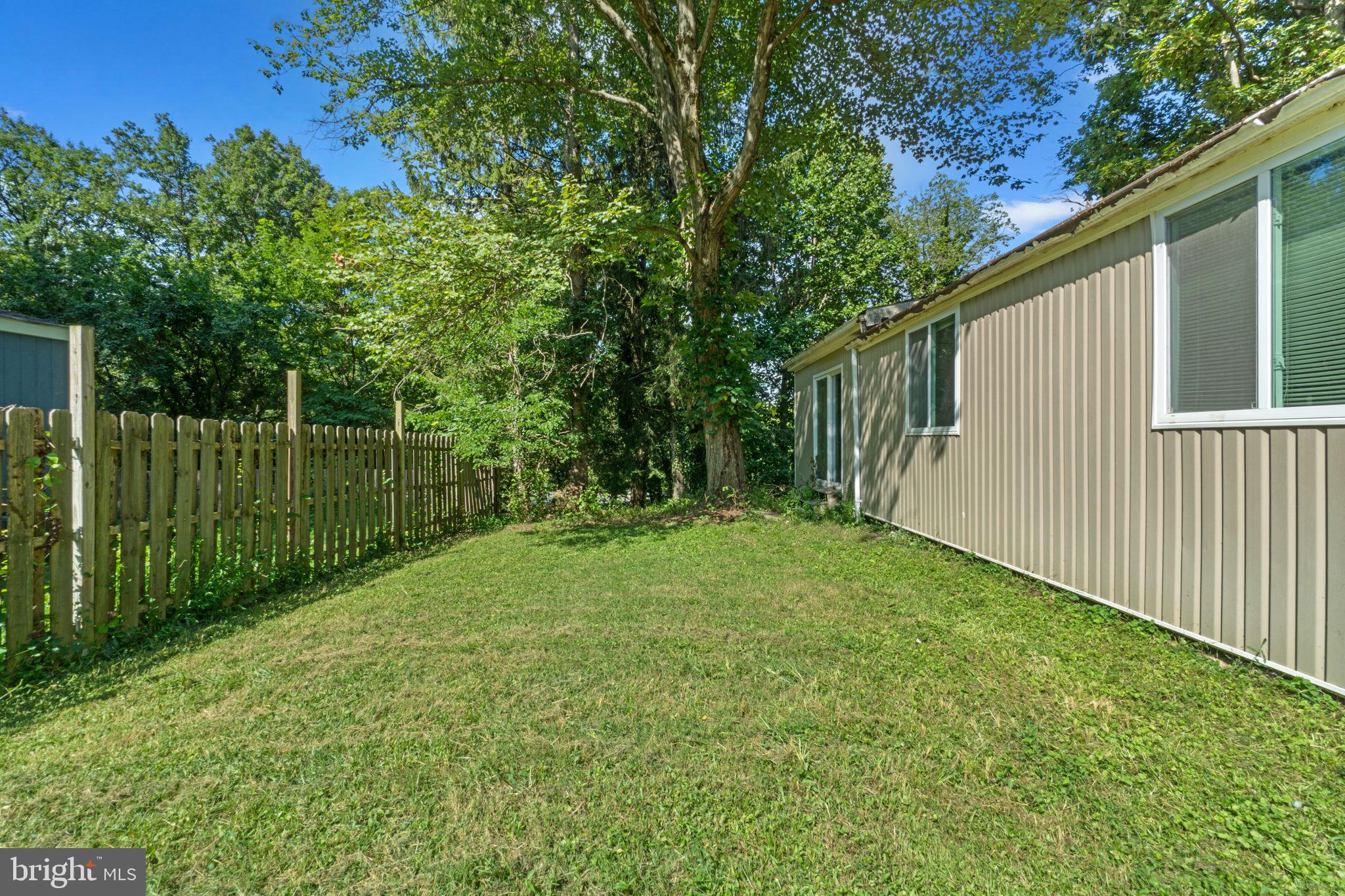 9528 Wandering Way Columbia, MD 21045 - Photo 27 of 29 a view of a backyard with a garden