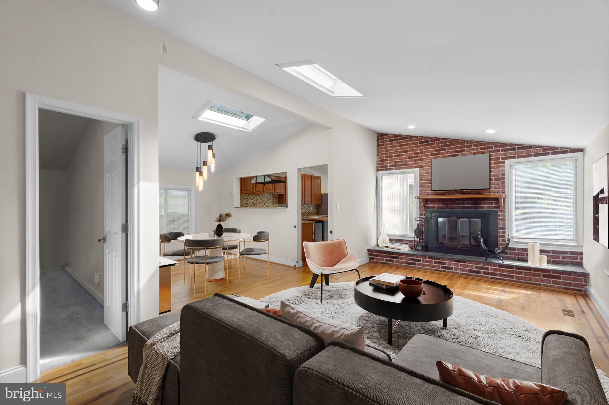 9528 Wandering Way Columbia, MD 21045 - Photo 3 of 29 a living room with furniture and a fireplace