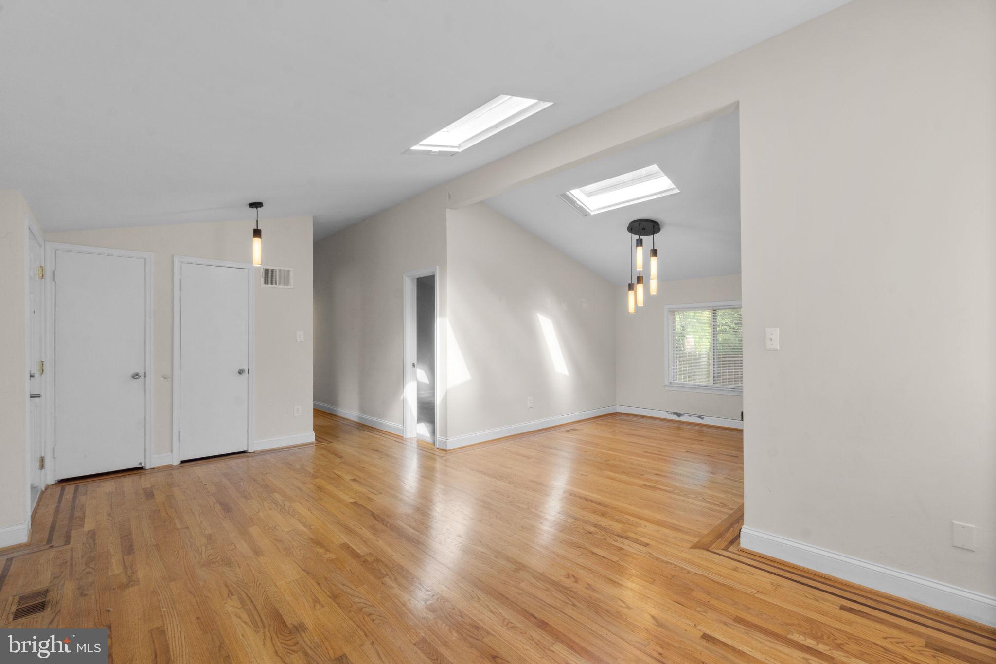 9528 Wandering Way Columbia, MD 21045 - Photo 6 of 29 a view of a livingroom with wooden floor