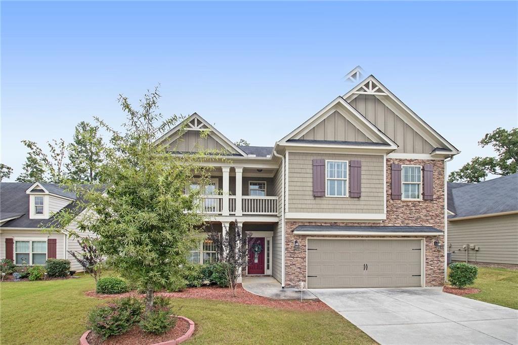 3339 Lynne Road Powder Springs, GA 30127 - Photo 1 of 1 a front view of a house with a garden and plants