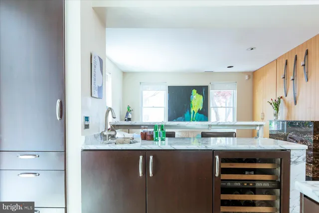 a kitchen with a sink cabinets and window