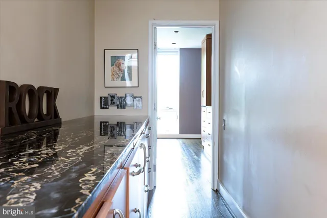 a kitchen with a refrigerator and a stove