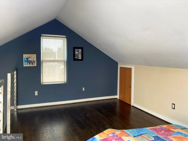 a view of gym equipment with wooden floor