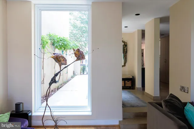 a view of an entryway with wooden floor and windows
