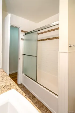 a bathroom with a toilet and a window