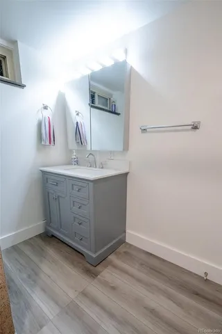 a bathroom with a sink and a mirror