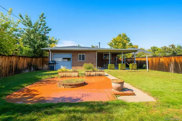 a view of a porch with chairs and backyard