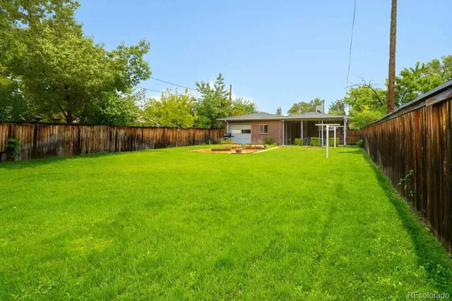 a view of a porch with wooden floor and iron stairs