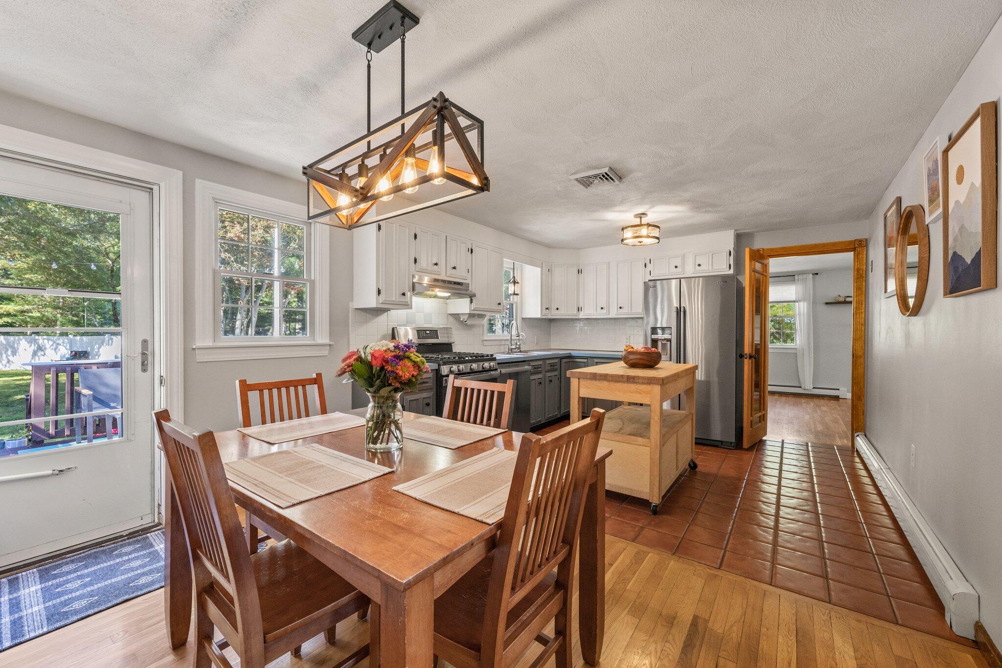 39 Maddaket Lane Centerville, MA 02632 - Photo 11 of 36 a view of a dining room with furniture window and wooden floor