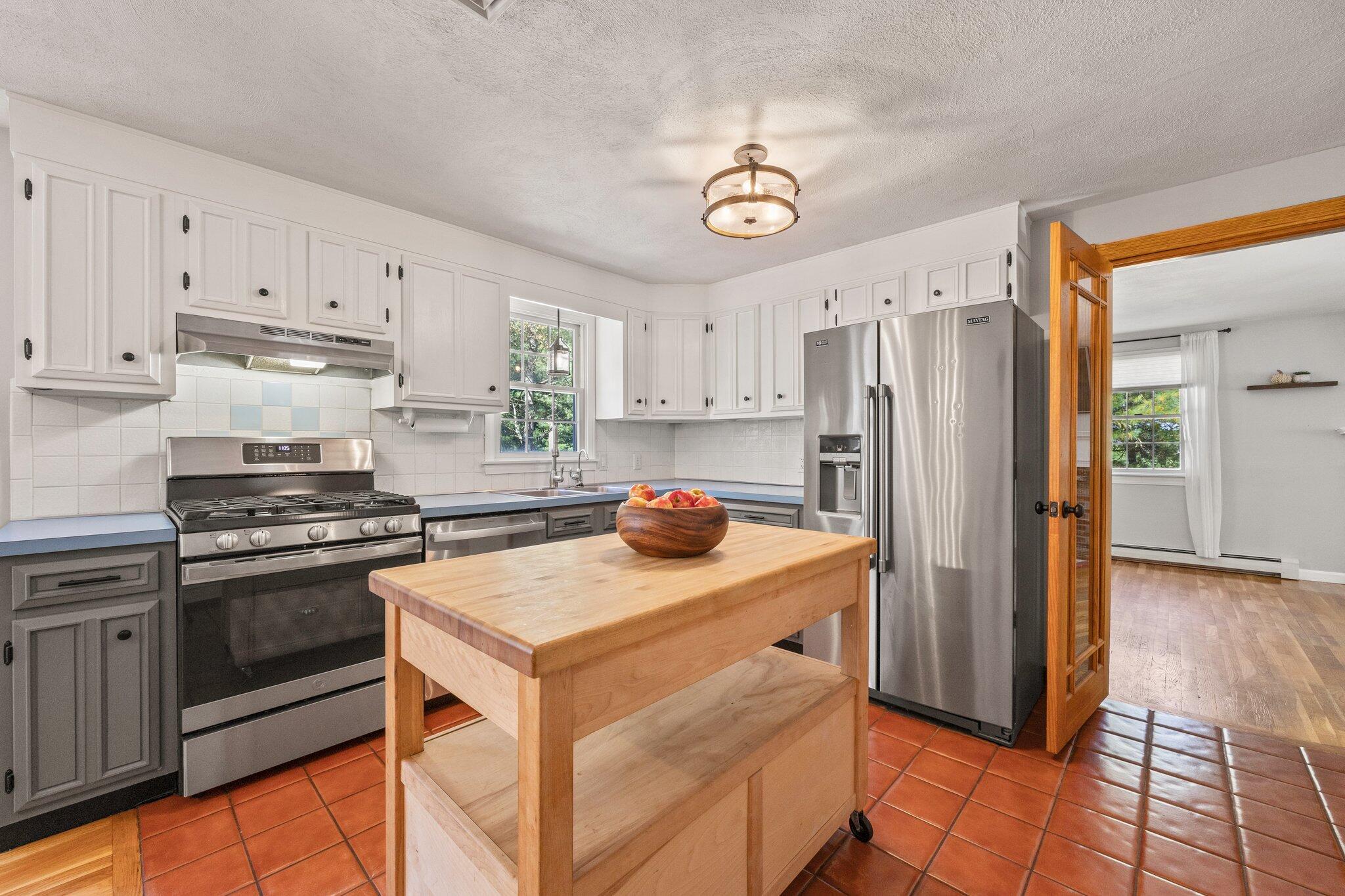 39 Maddaket Lane Centerville, MA 02632 - Photo 12 of 36 a kitchen with stainless steel appliances granite countertop a refrigerator stove top oven and sink