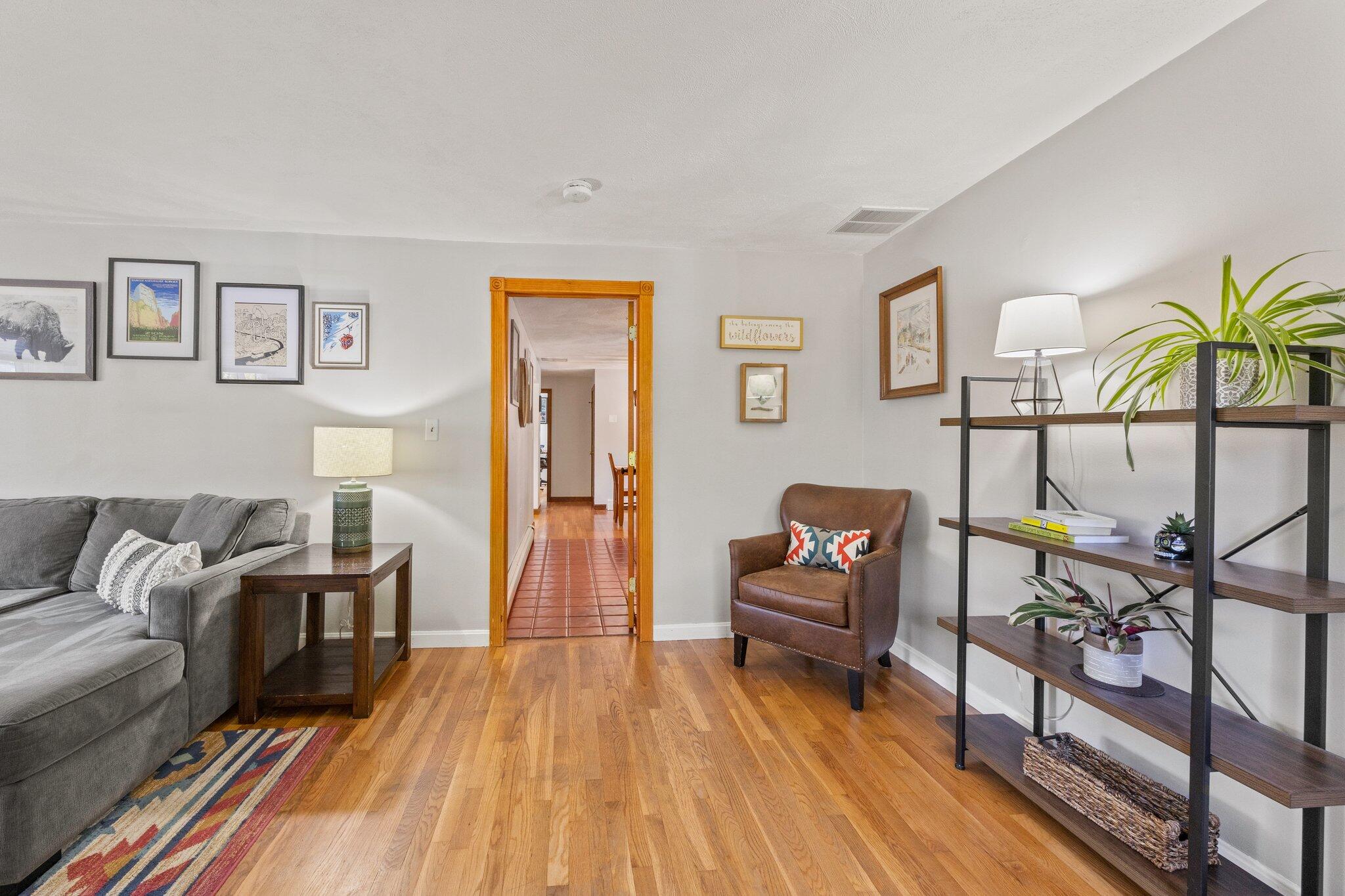 39 Maddaket Lane Centerville, MA 02632 - Photo 17 of 36 a living room with furniture and a wooden floor