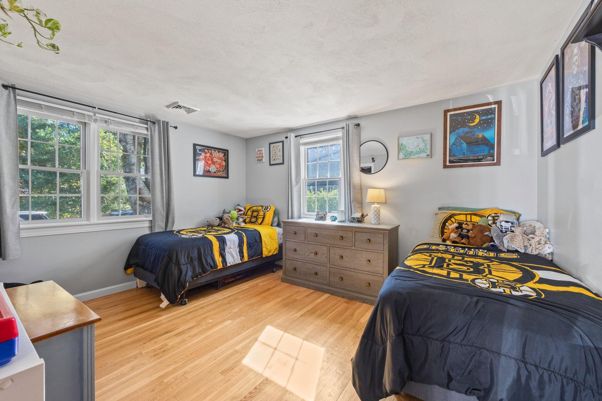 39 Maddaket Lane Centerville, MA 02632 - Photo 18 of 36 a bedroom with a bed and wooden floor