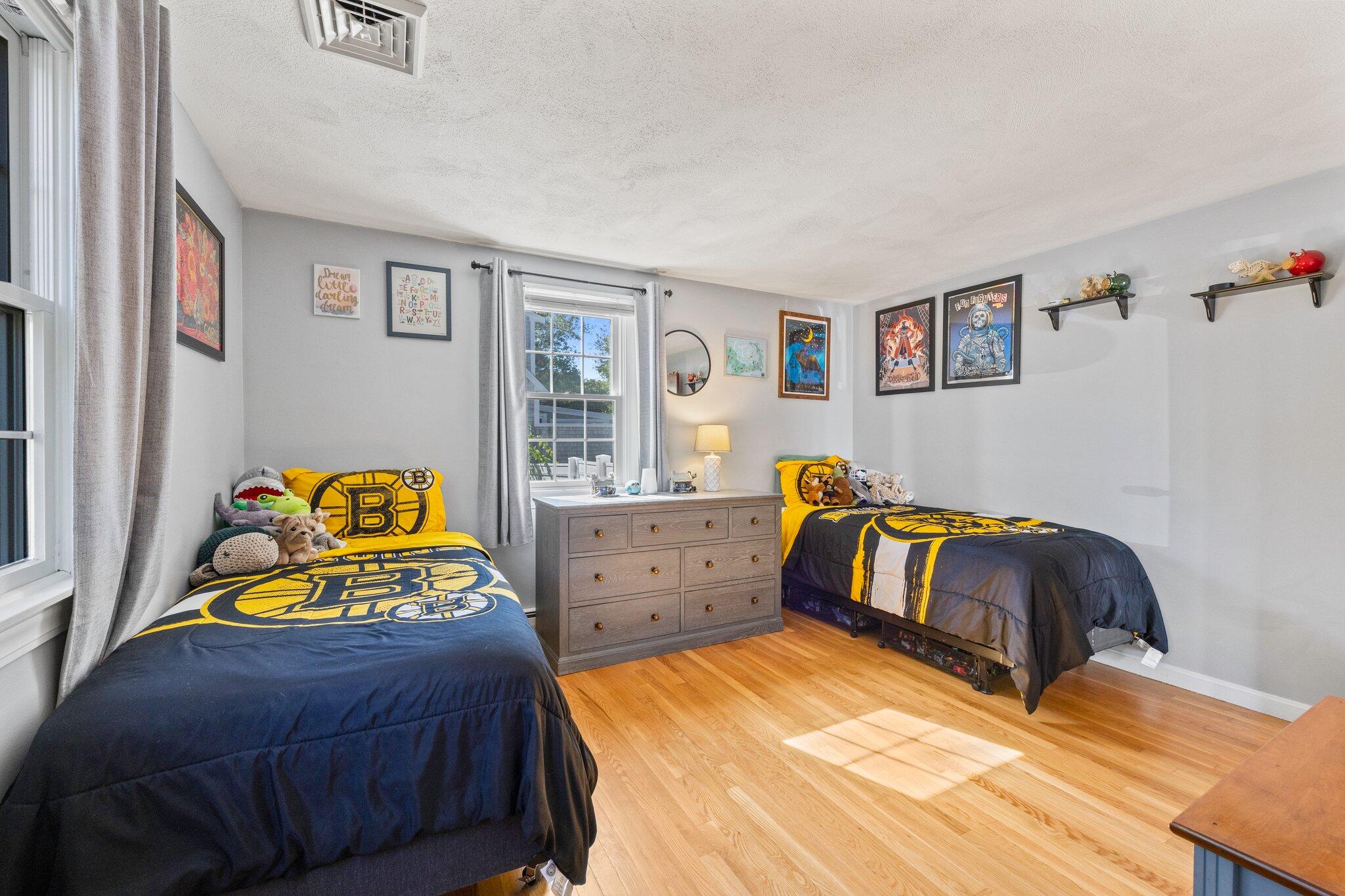 39 Maddaket Lane Centerville, MA 02632 - Photo 19 of 36 a bedroom with a bed and a dresser