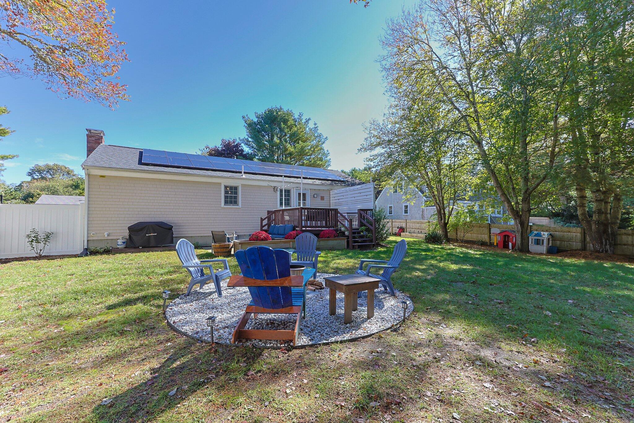 39 Maddaket Lane Centerville, MA 02632 - Photo 28 of 36 a front view of a house with garden and trees