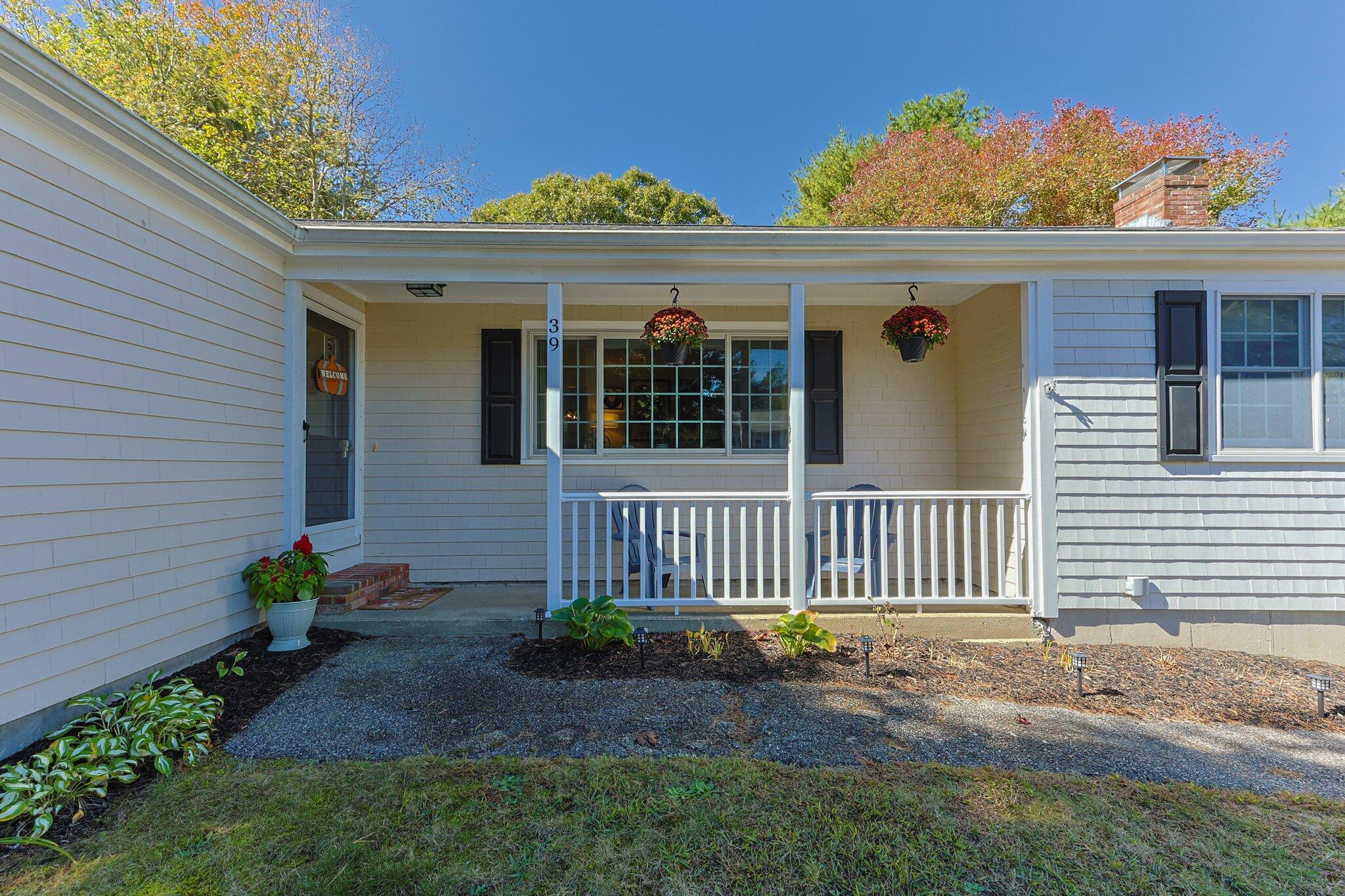 39 Maddaket Lane Centerville, MA 02632 - Photo 5 of 36 a view of a house with a small yard and wooden fence