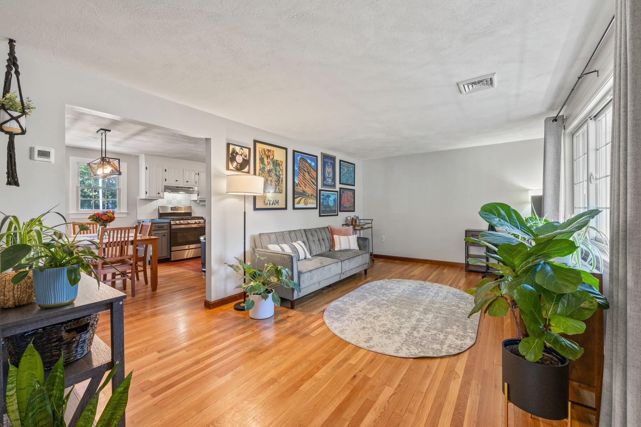 39 Maddaket Lane Centerville, MA 02632 - Photo 8 of 36 a living room with furniture and a wooden floor