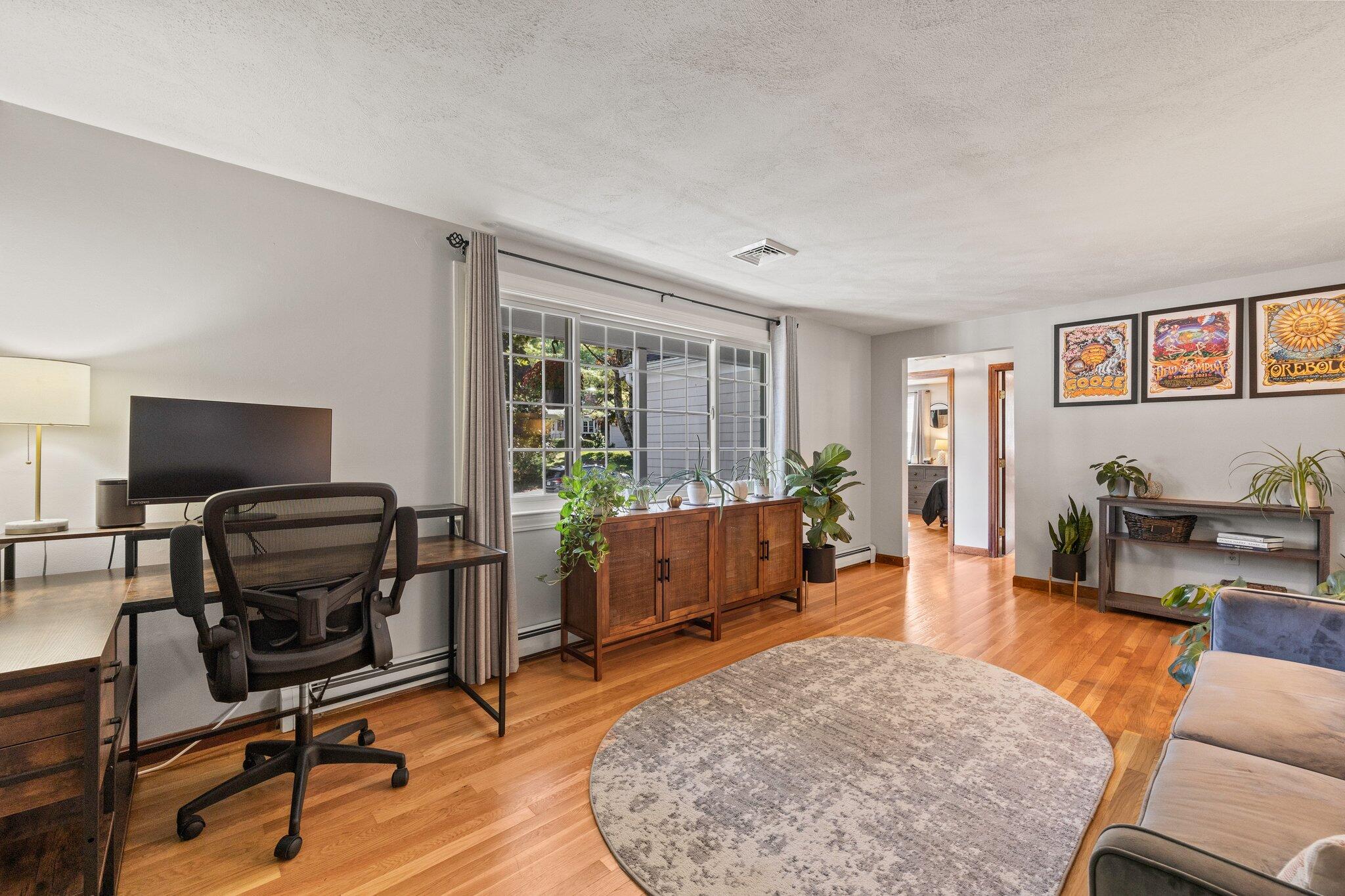 39 Maddaket Lane Centerville, MA 02632 - Photo 9 of 36 a living room with furniture a flat screen tv and a window