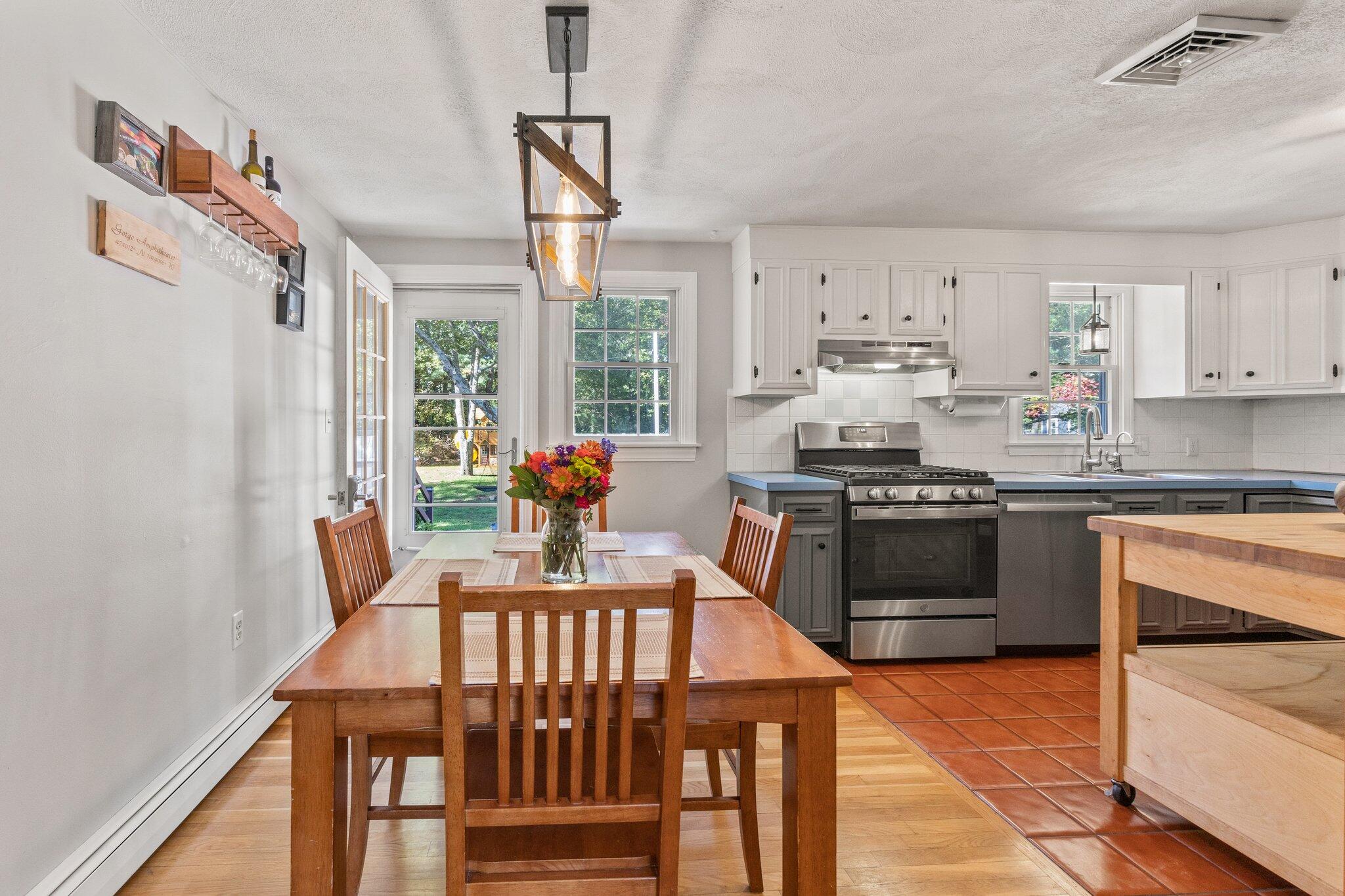 39 Maddaket Lane Centerville, MA 02632 - Photo 10 of 36 a kitchen with stainless steel appliances kitchen island granite countertop a stove a sink and a refrigerator