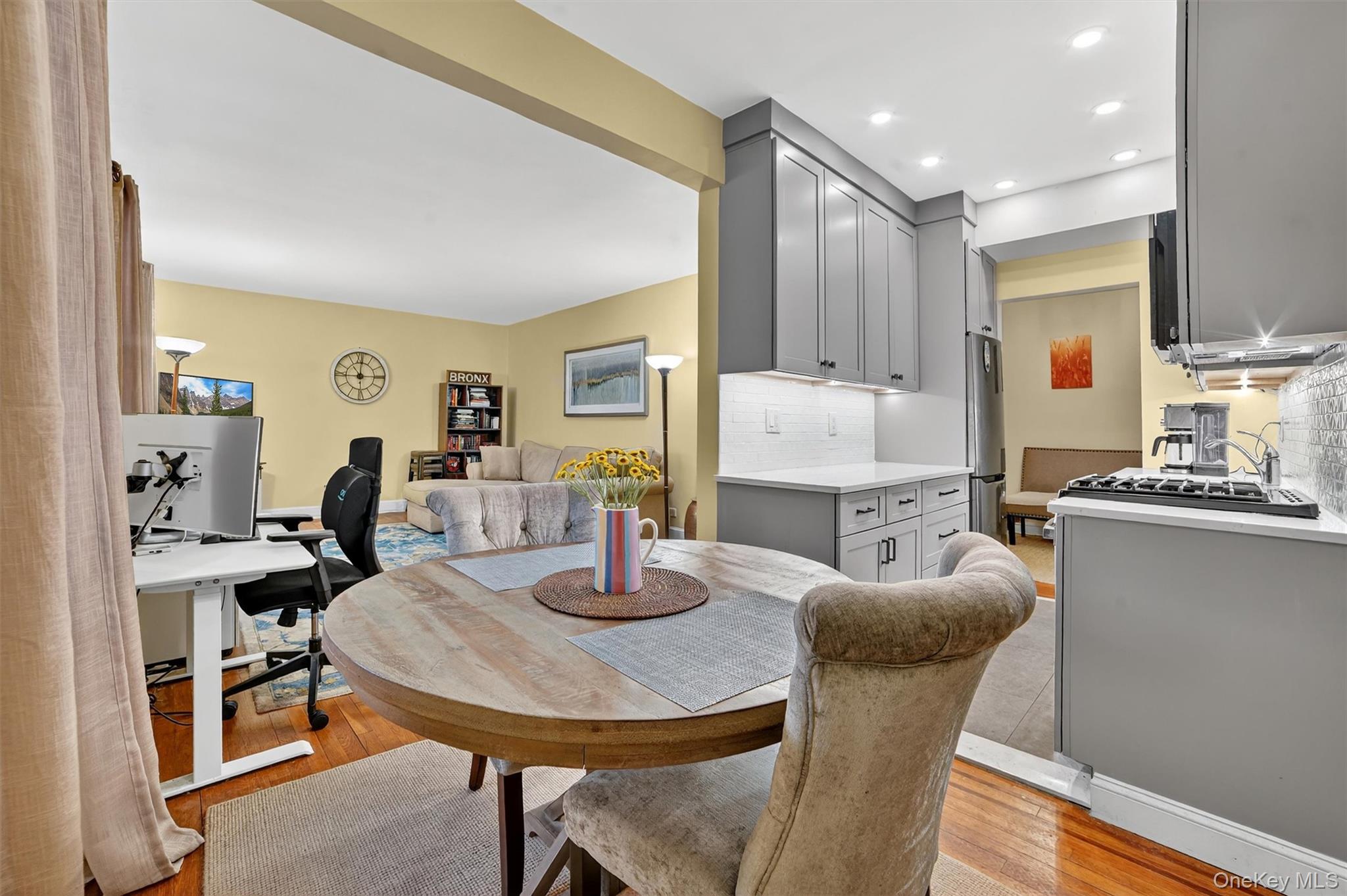 824 Palmer Road, Unit 2D Bronxville, NY 10708 - Photo 18 of 29 a kitchen with a dining table chairs and granite counter tops