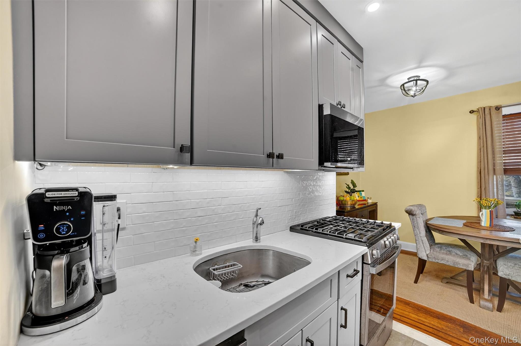 824 Palmer Road, Unit 2D Bronxville, NY 10708 - Photo 20 of 29 a kitchen with a sink a stove and a refrigerator